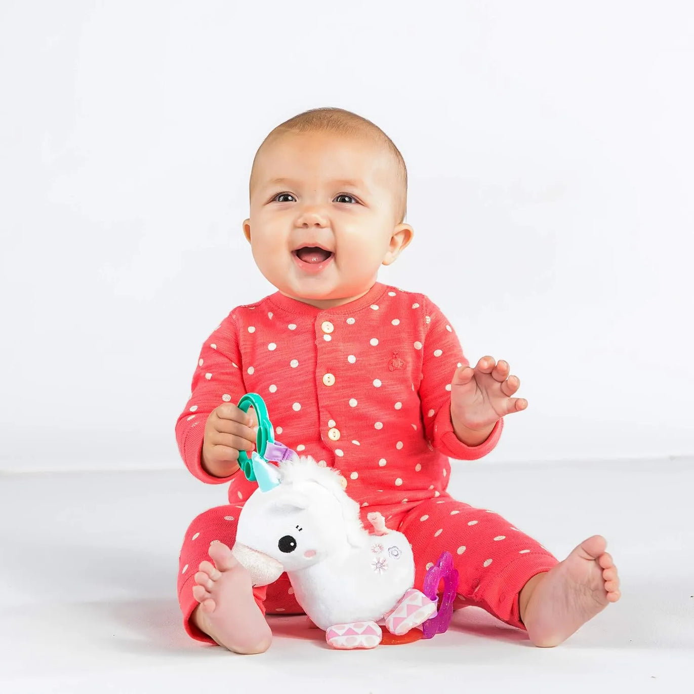 Unicornio Bright Starts Sparkle & Shine con sonajero y mordederas · 0+ meses