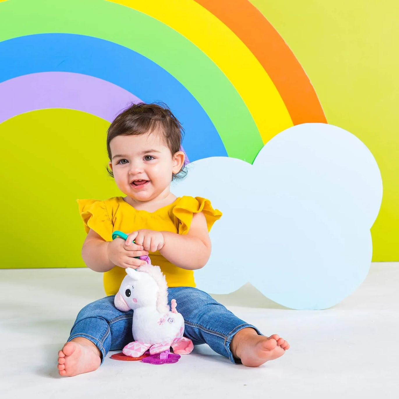 Unicornio Bright Starts Sparkle & Shine con sonajero y mordederas · 0+ meses